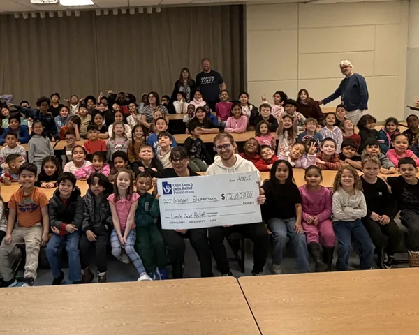 Students at Granger Elementary with a $12,000 Utah Lunch Debt Relief Foundation check
